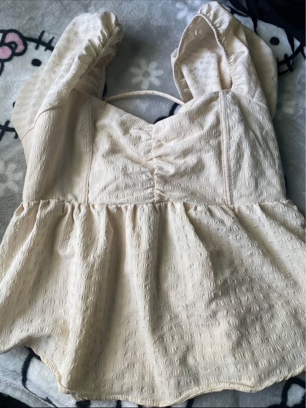 Cream Textured Sweetheart Neckline Peplum Top